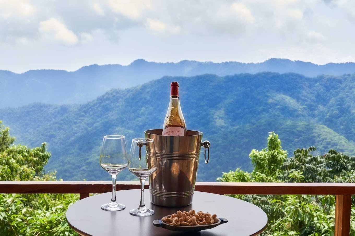 A breathtaking aerial view of Bwindi Impenetrable National Park, with mist-covered hills and dense rainforest stretching into the horizon.
